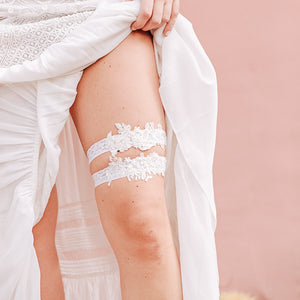 White lace floral garter set with non slip grip on model's leg